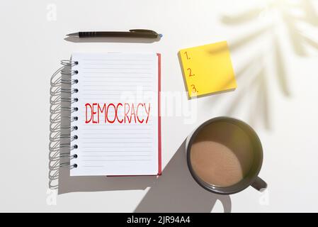 Writing displaying text Demo Cracy. Business overview freedom of the showing to express their feelings and beliefs Notebook With Important Messages On Stock Photo