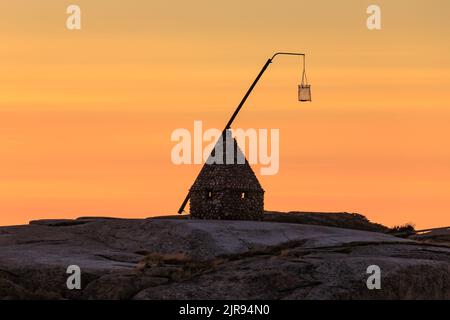Sunset at the end of the world - Vippefyr ancient lighthouse at Verdens Ende in Norway Stock Photo