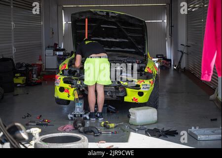 The mechanic and driver of Nissan Silvia S14 Zenki repairing his car after an accident Stock Photo