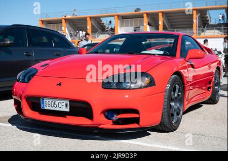 A front view of a red Mitsubishi 3000Gt parked on the street Stock Photo