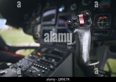 Close-up of helicopter flight control inside cockpit. Stock Photo