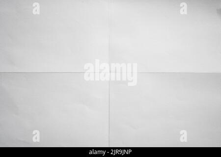 White paper crisp folded in four fraction background Stock Photo