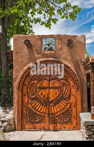 Wooden door at Native American Cenacle of Chimayo, El Santuario de Chimayo, National Historic Landmark, Chimayo, New Mexico, USA Stock Photo