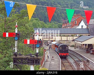 Bunting over Llangollen preserved railway Station, signals, Denbighshire, North Wales, UK, LL20 8SN Stock Photo