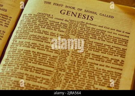 Close up of antique Holy Bible page, shallow depth of field with focus on chapter title heading, Genesis Stock Photo