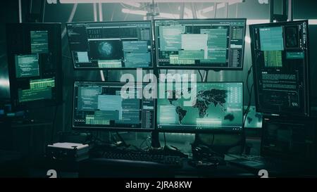 Pan around view of modern computer monitor with world map and various data located on desk in dark room of hacker base Stock Photo