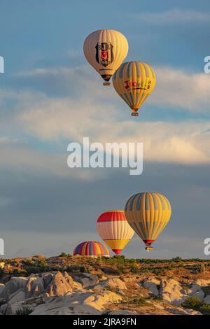 GOREME/TURKEY - June 27, 2022: hot air balloons fly over goreme Stock Photo