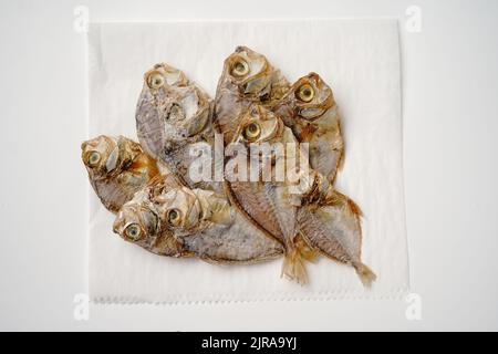 Salted dry fish cod isolated on white background Stock Photo