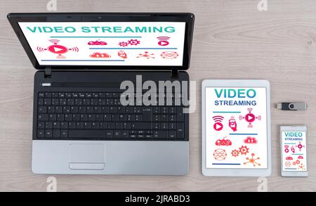 Video streaming concept shown on different information technology devices Stock Photo