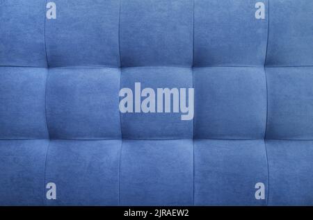 Blue suede leather background for the wall in the room. Interior design, headboards made of furniture fabric, furniture upholstery. Classic checkered Stock Photo