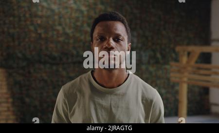 African American military man looking at camera during break in gym of USA military base Stock Photo
