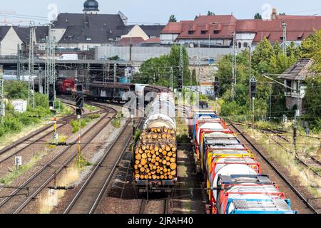 Above view of railway sorting station with many lines directions in Germany. Railroad car wooden timber logs and gas tanks logistics. Raw wood heating Stock Photo