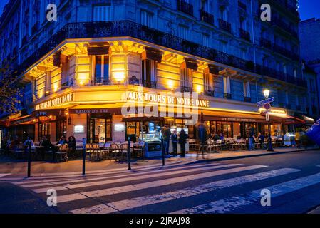 PARIS, FRANCE -APRIL 6, 2018 Tourist streets with cafes and restaurants in Paris at night Stock Photo