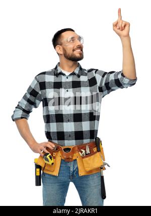 happy male worker or builder with tool belt Stock Photo