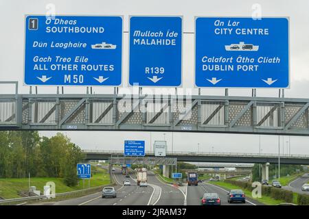 Road signs over a motorway giving traffic directions, taken at Dublin city, Ireland. Stock Photo