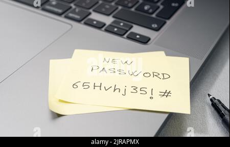 Change of password to a stronger one- Message on sticky note on laptop. Computer security management concept Stock Photo