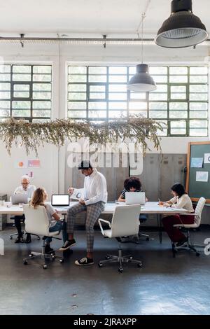 Multiracial coworkers working in office Stock Photo