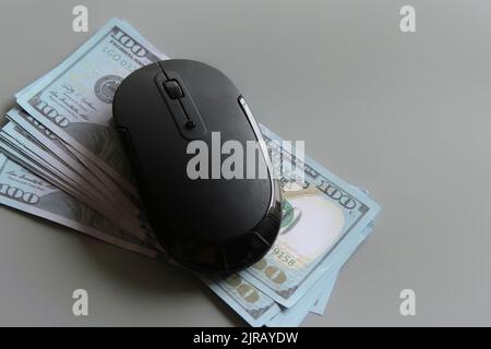 US dollar and computer mouse. Pay per click, online banking, shopping and business concept Stock Photo