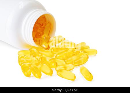 Pile of softgels capsules Omega 3 in bottle isolated on white background. Close up with copy space Stock Photo