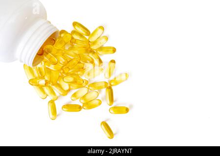 Pile of softgels capsules Omega 3 in bottle isolated on white background. Close up, top view, flat lay with copy space Stock Photo