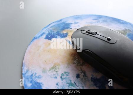 Computer mouse and globe. Internet, global business network, digital technology concept. Stock Photo