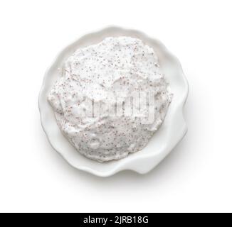 Top view of exfoliating body scrub in white ceramic cup isolated on white Stock Photo