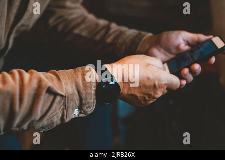 Senior man using mobile phone Stock Photo