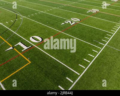 Football Netview Slanted Synthetic turf football field twenty, 20, yard line in white Stock ...