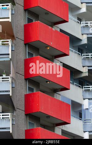 Germany, North Rhine-Westphalia, Cologne, Row of red painted apartment balconies Stock Photo