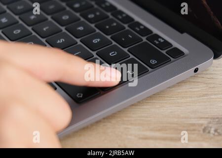 Enter button, woman finger pressing enter button. Stock Photo