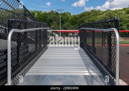 Accessible wheelchair ramp with railings and slip resistant surface at ...