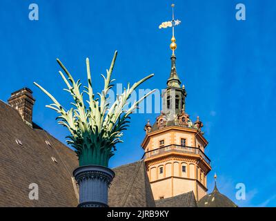 Germany, Saxony, Leipzig, Nikolaisaule column with tower of Saint Nicholas Church in background Stock Photo