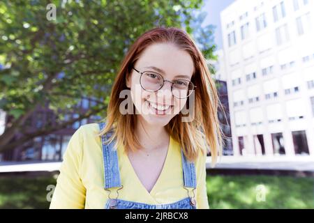 Happy young woman wearing eyeglasses Stock Photo