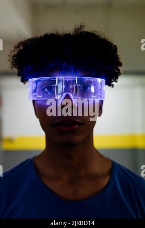 Young man wearing futuristic glasses in subway Stock Photo