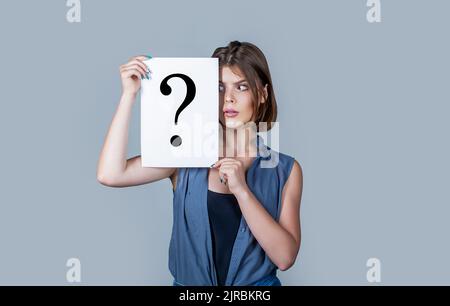 Woman with doubtful expression and question marks. Question mark, symbol. Girl question. Getting answers Stock Photo