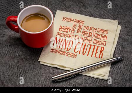 mind clutter word cloud on napkin with a cup of coffee, mental health and personal development concept Stock Photo