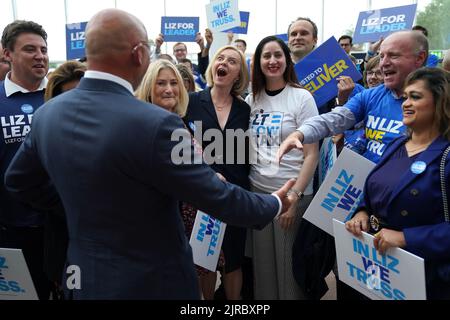 Liz Truss reacts as Chancellor Nadhim Zahawi (left) arrives at a hustings event at the NEC in Birmingham as part of her campaign to be leader of the Conservative Party and the next prime minister. Picture date: Tuesday August 23, 2022. Stock Photo