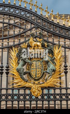 Royal golden coat of arms at the main Buckingham Palace gate in London ...