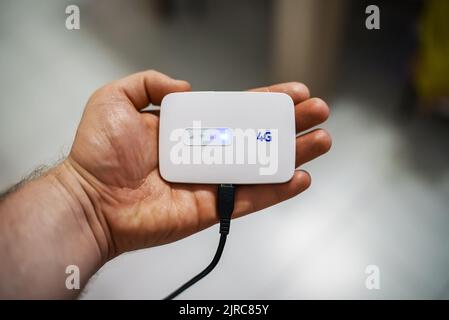 Modern wireless pocket 4g wifi modem. Stock Photo