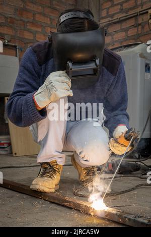 Man welding with his working tools Stock Photo