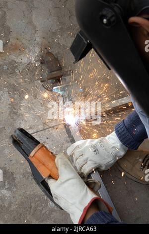 Man welding with his working tools Stock Photo