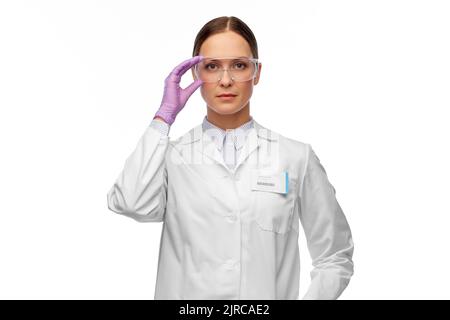 female scientist in goggles and gloves Stock Photo