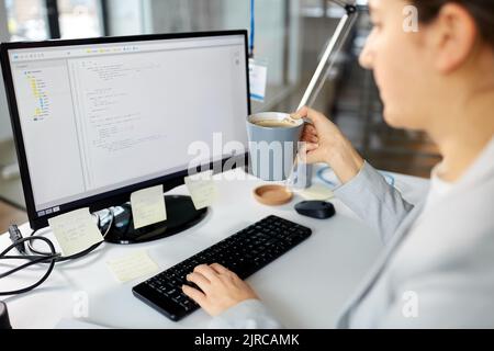 businesswoman with computer and coffee at office Stock Photo