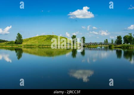 A calm lake with reflections at the Winkler Bible Camp, Winkler, Manitoba, Canada. Stock Photo