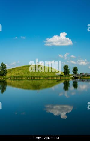 A calm lake with reflections at the Winkler Bible Camp, Winkler, Manitoba, Canada. Stock Photo