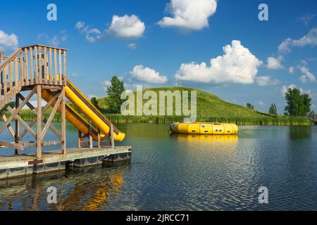 A calm lake with reflections at the Winkler Bible Camp, Winkler, Manitoba, Canada. Stock Photo