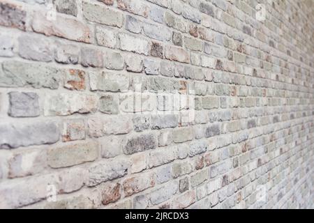 Ornamental brick wall forms part of interior in house inside Stock Photo