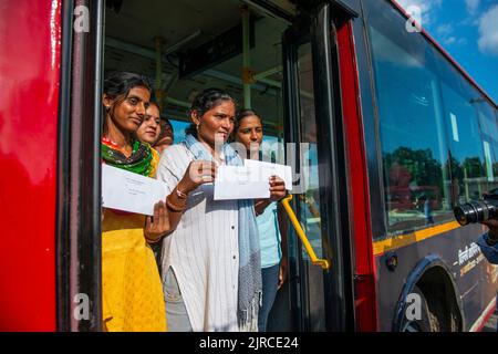 New Delhi, India. 23rd Aug, 2022. Newly appointed women bus drivers show their appointment letters during an event at Rajghat Depot, New Delhi. 11 women drivers got employment letters after completing their training, Delhi Transport Minister Kailash Gahlot said that the government is planning to recruit 200 women drivers for the DTC buses as part of its effort to provide employment opportunities to them. (Photo by Pradeep Gaur/SOPA Images/Sipa USA) Credit: Sipa USA/Alamy Live News Stock Photo