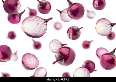 Falling red onion isolated on white background, selective focus Stock Photo