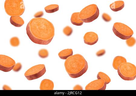 Falling sweet potato, slice, isolated on white background, selective focus Stock Photo